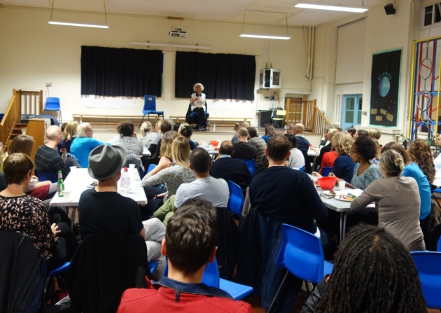 Rosalie delivering a talk to a group of parents